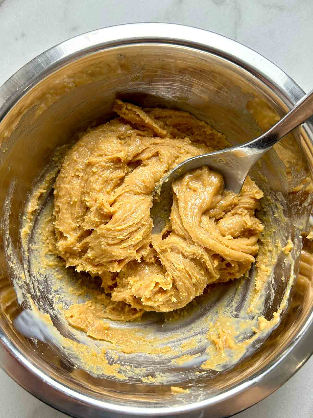 peanut butter filling being mixed in bowl.