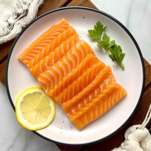 salmon sashimi on plate.