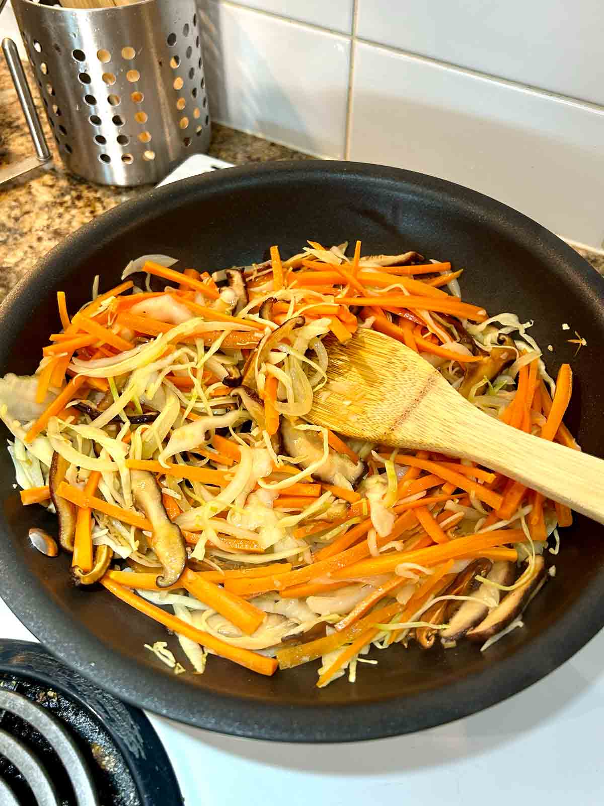 vegetables cooking in pan.