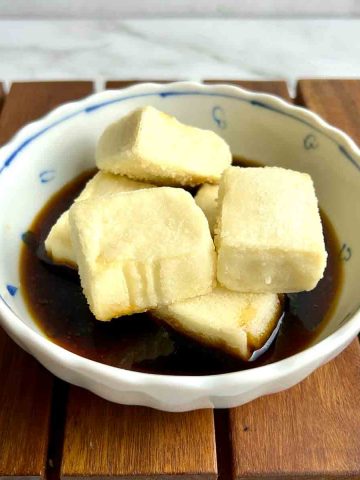 cubes of agedashi tofu in soy-based broth.