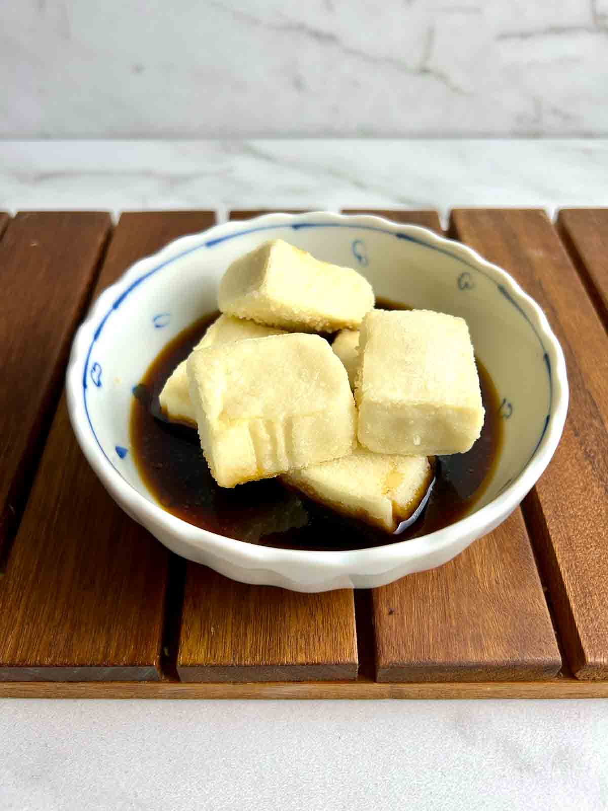 cubes of agedashi tofu in soy-based broth.