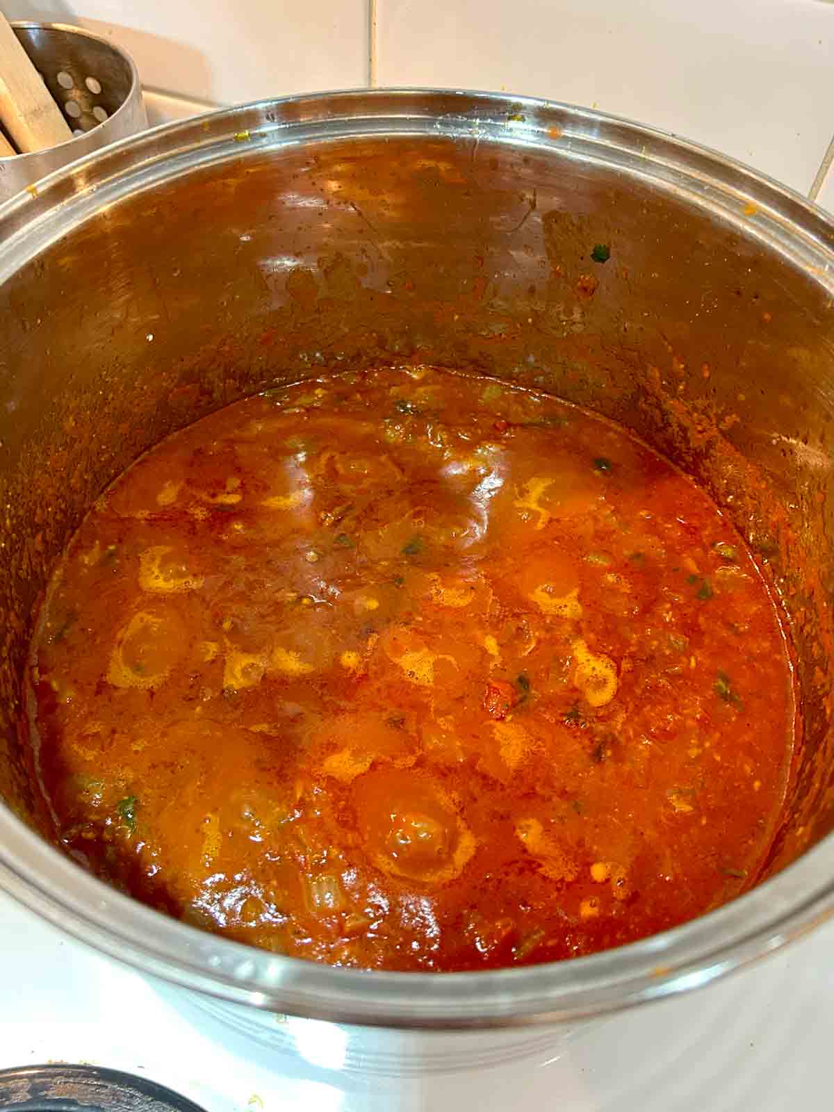 oil separating from tomato and onion masala.