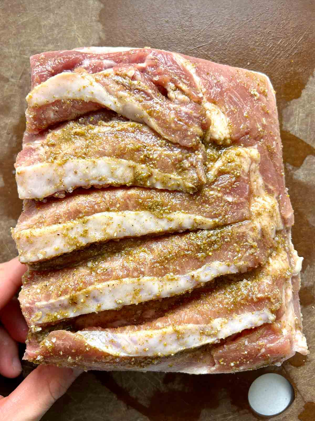 meat side being seasoned with spice mixture.