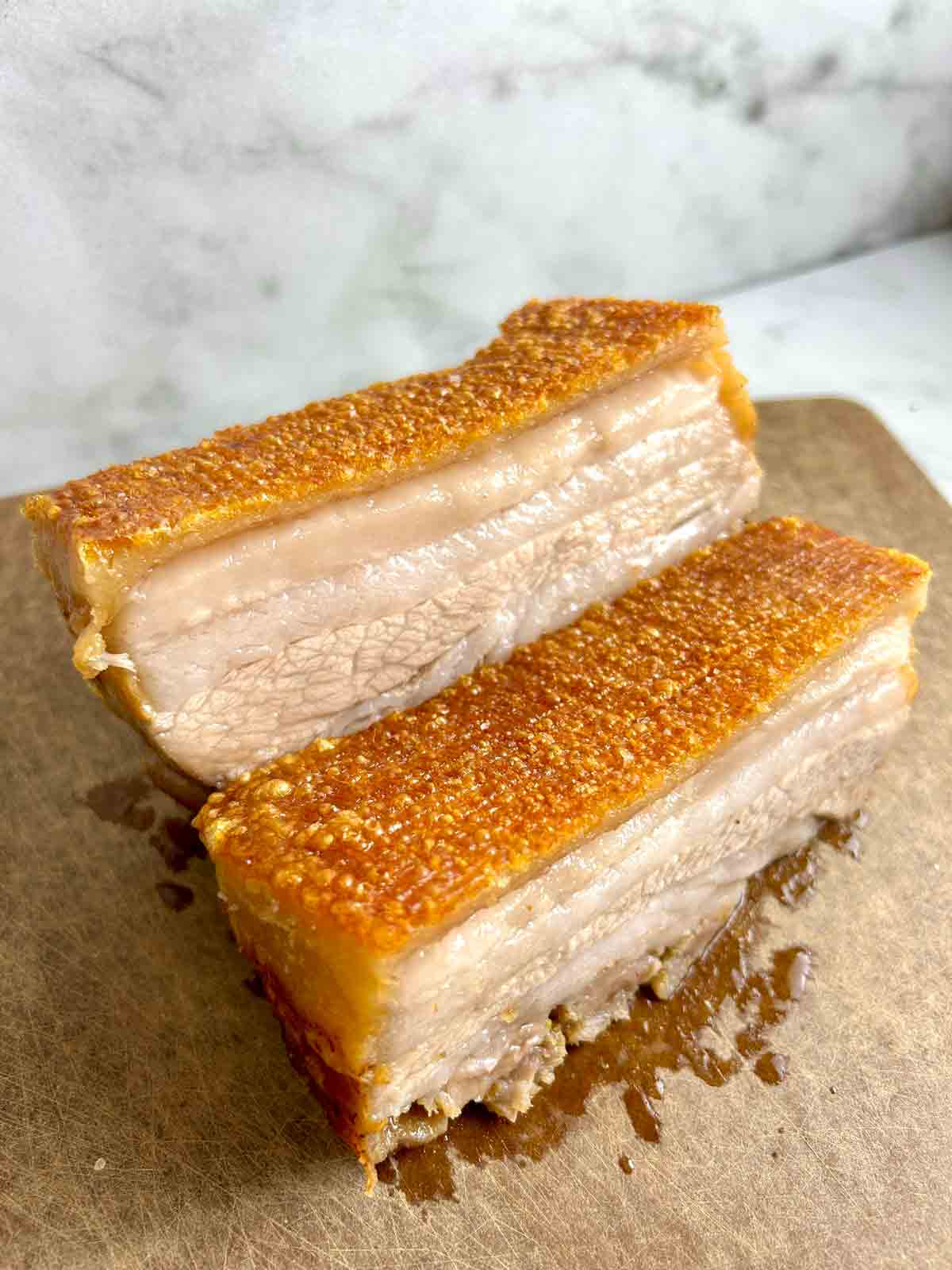 two slabs of pork belly with crispy skin.