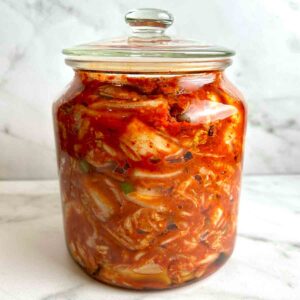 jar of kimchi in glass cookie jar.