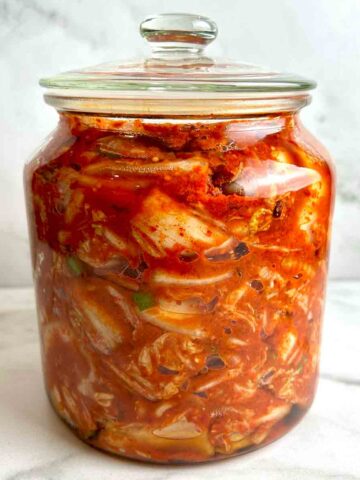 jar of kimchi in glass cookie jar.