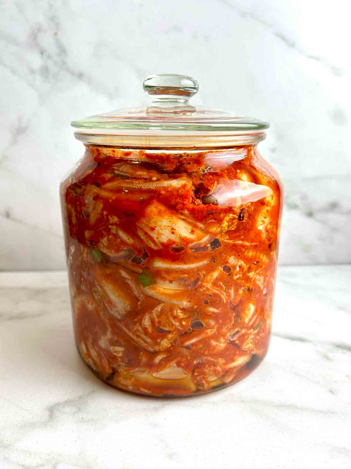 jar of kimchi in glass cookie jar.