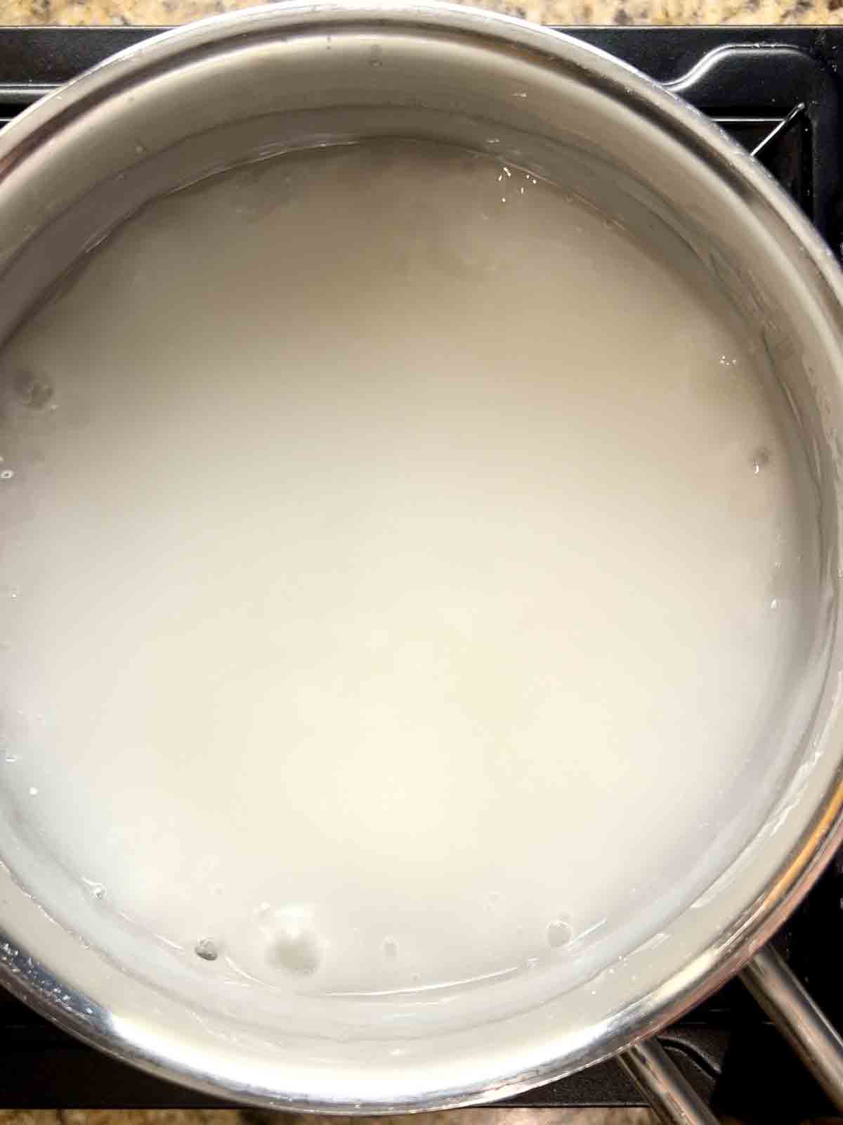 rice glue being thickened in small saucepan.