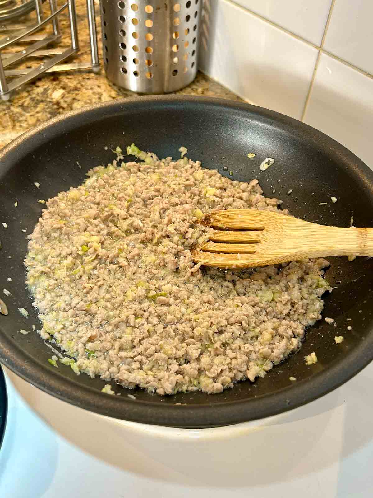 stir-frying pork with aromatics.