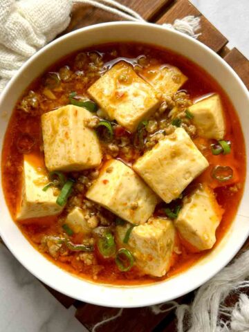 overhead shot of mapo tofu in small bowl.