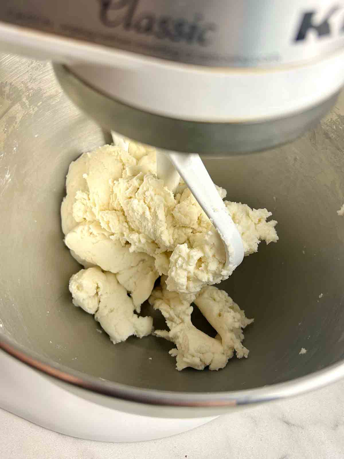 dough forming in stand mixer.