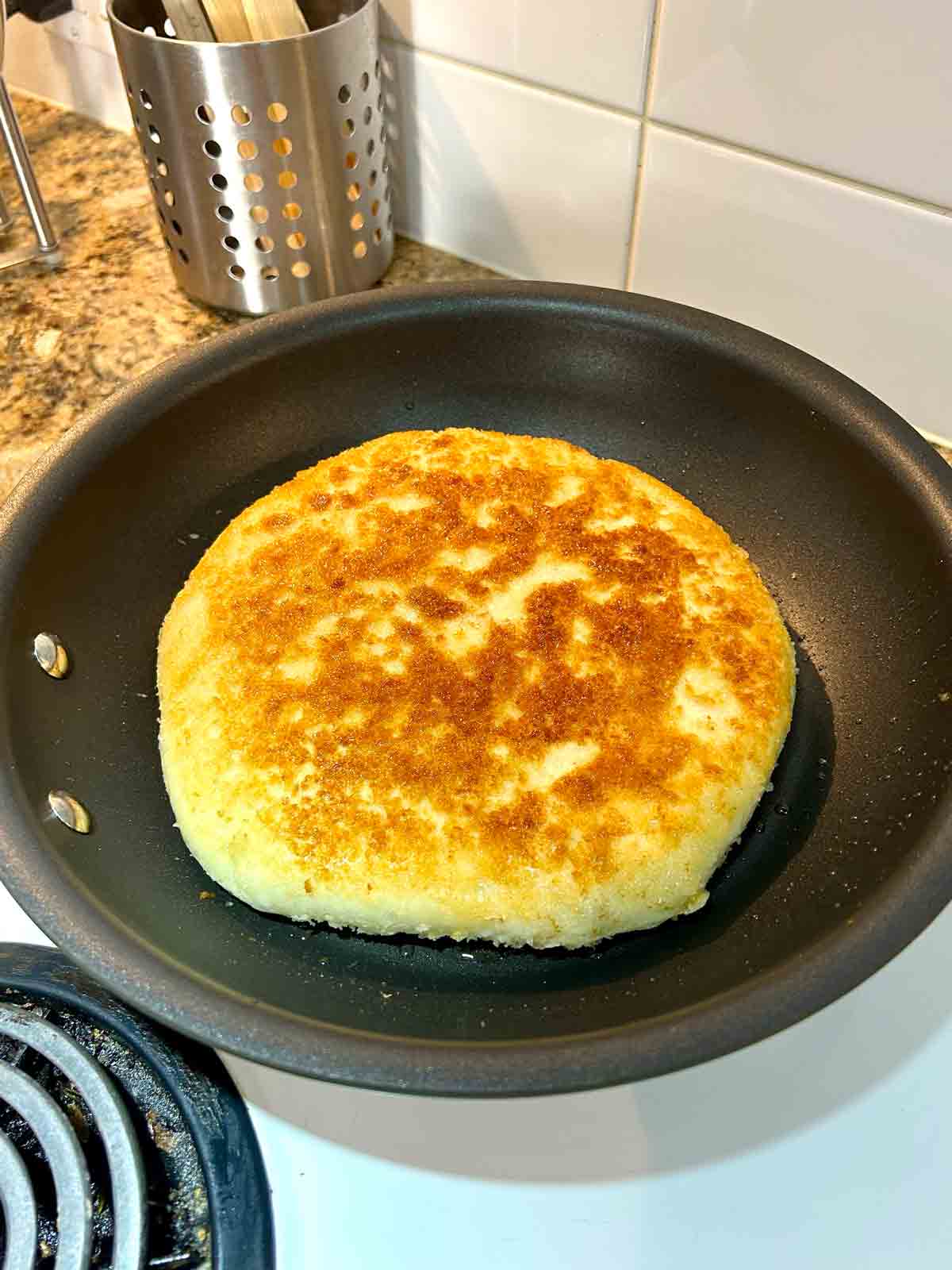 crispy and golden brown side of bread after cooking for 5 minutes.