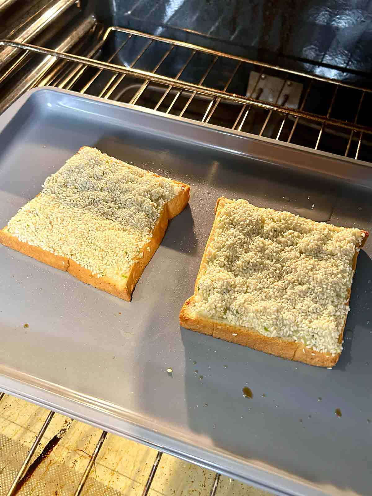 shrimp toast being baked in oven.