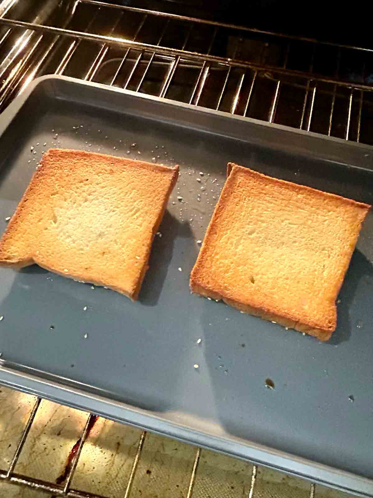 golden brown, crispy bread side of shrimp toast in the oven.