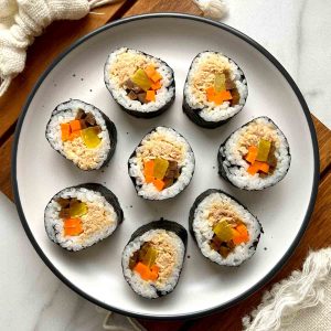 spicy tuna kimbap on plate.