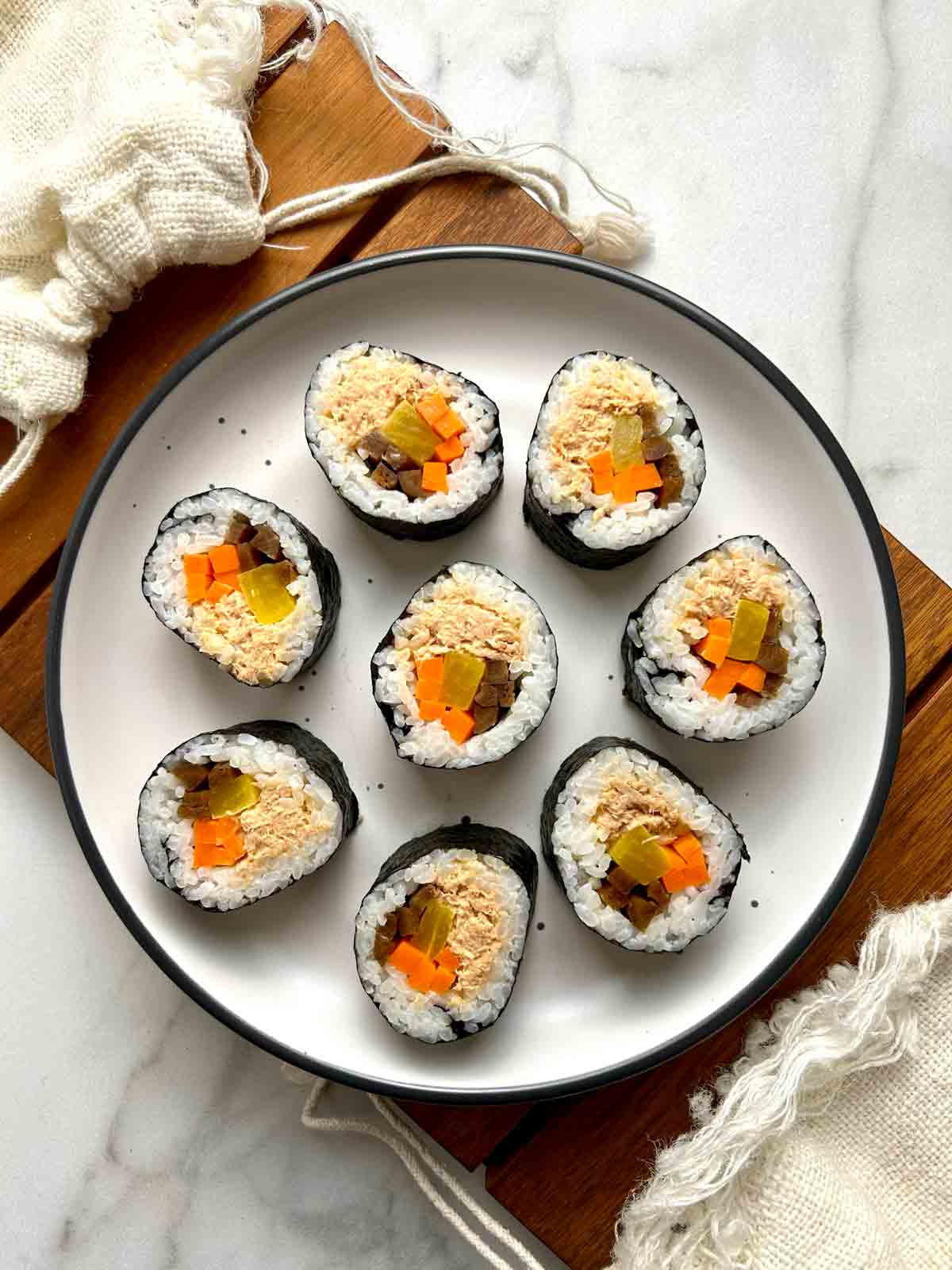 spicy tuna kimbap on plate.