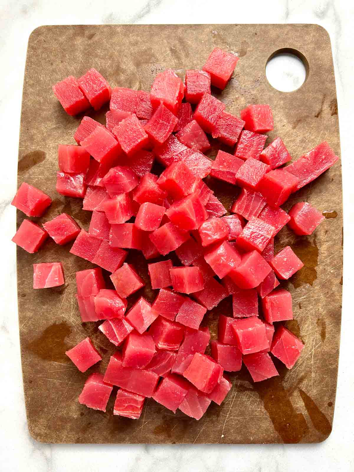 raw tuna in the shape of poke cubes.