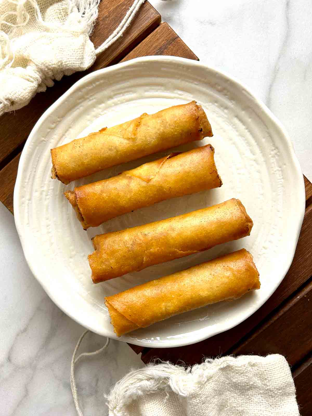 fried spring rolls on plate.