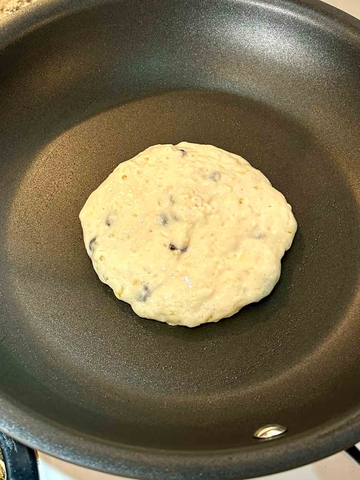 first side of pancake cooking.