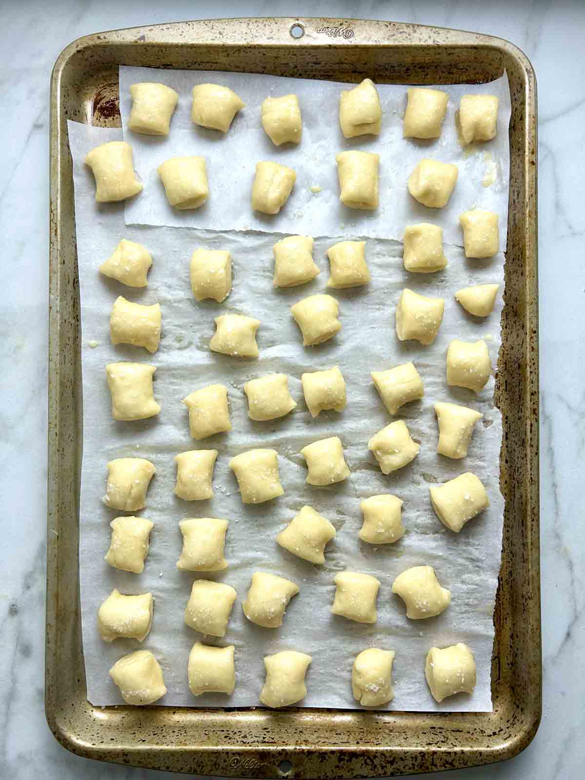 bites after being boiled, egg wash brushed on, and salt sprinkled on.