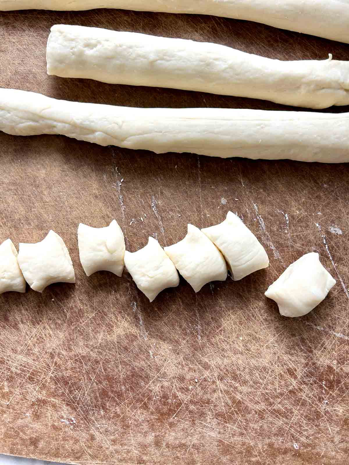 dough being cut into 1-inch bites.