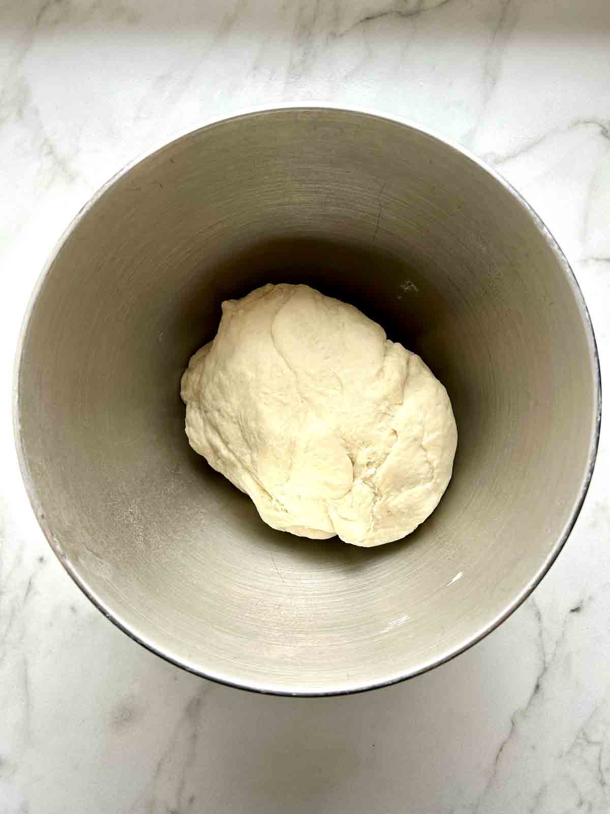 smooth dough in mixing bowl.