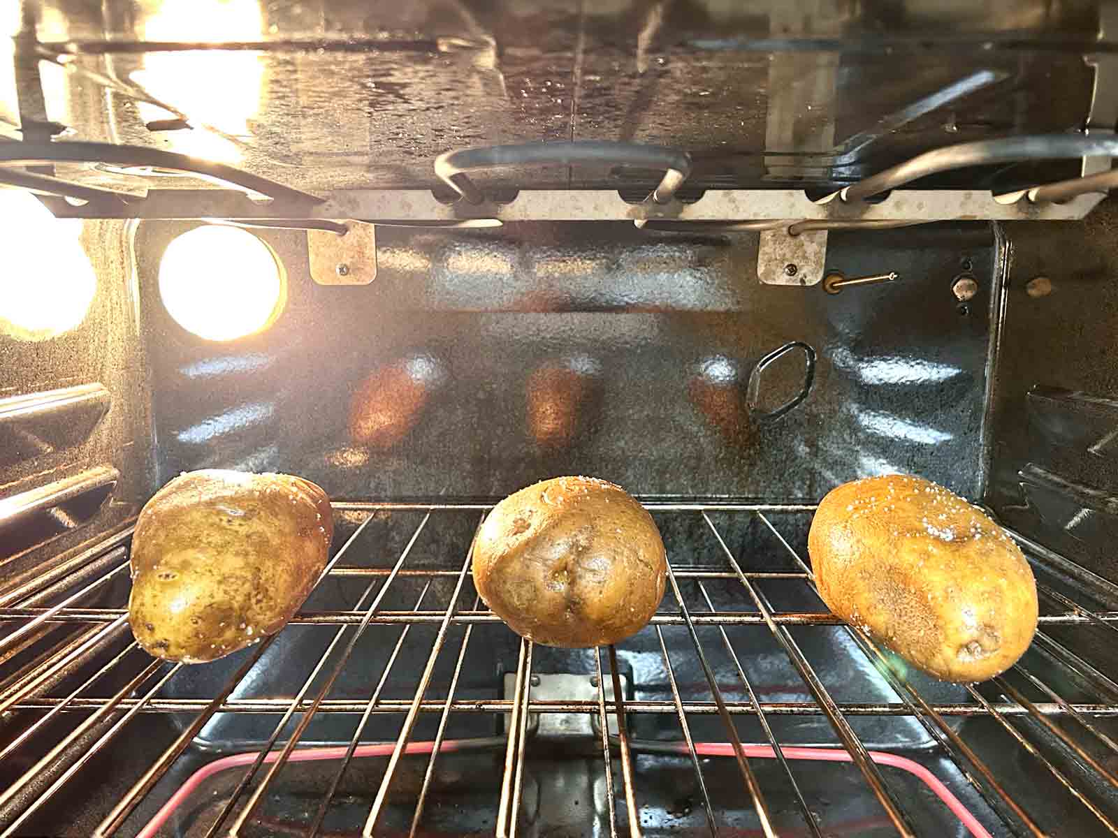 potatoes baking directly on oven rack.