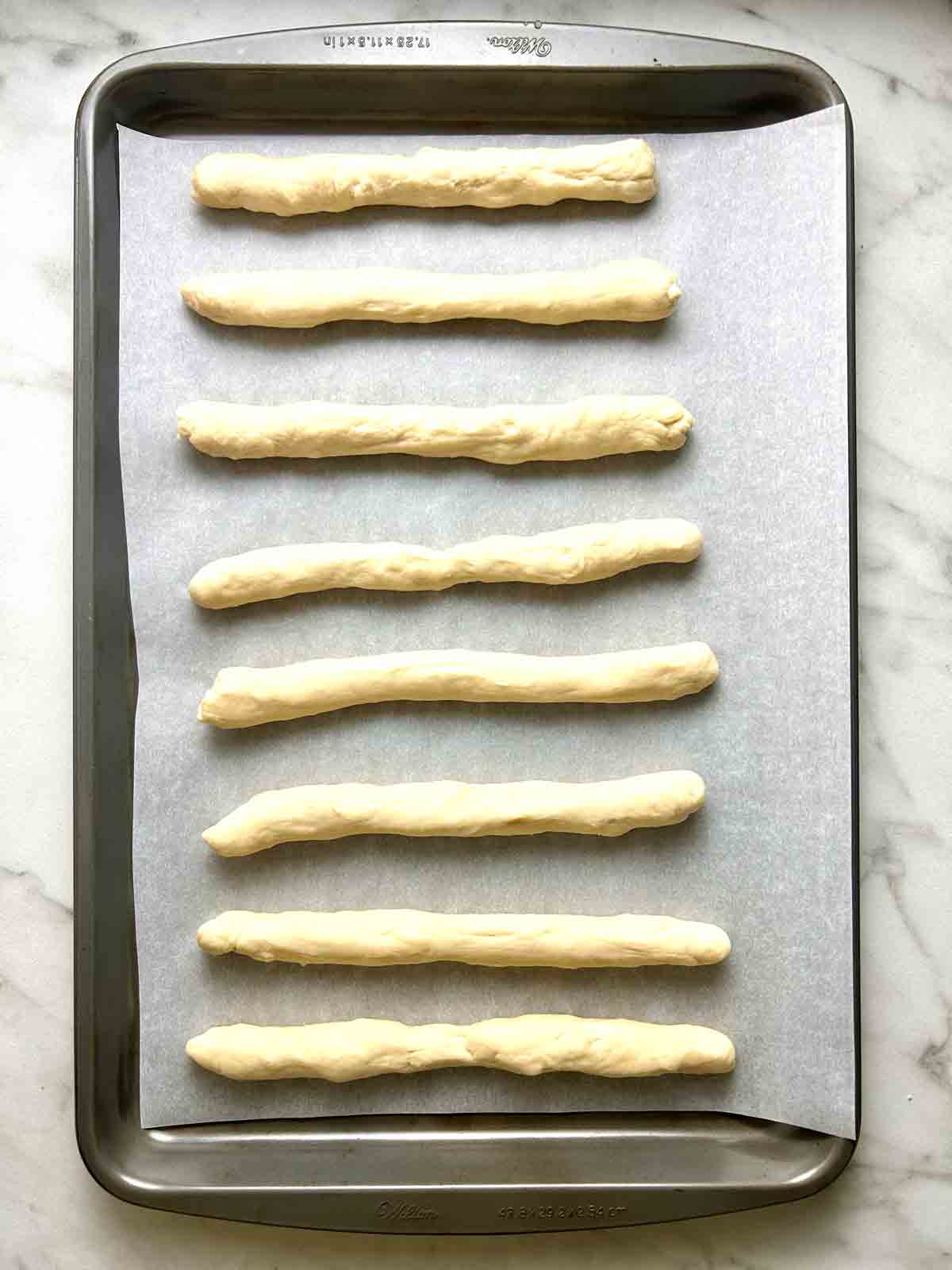 pieces of dough on baking sheet.