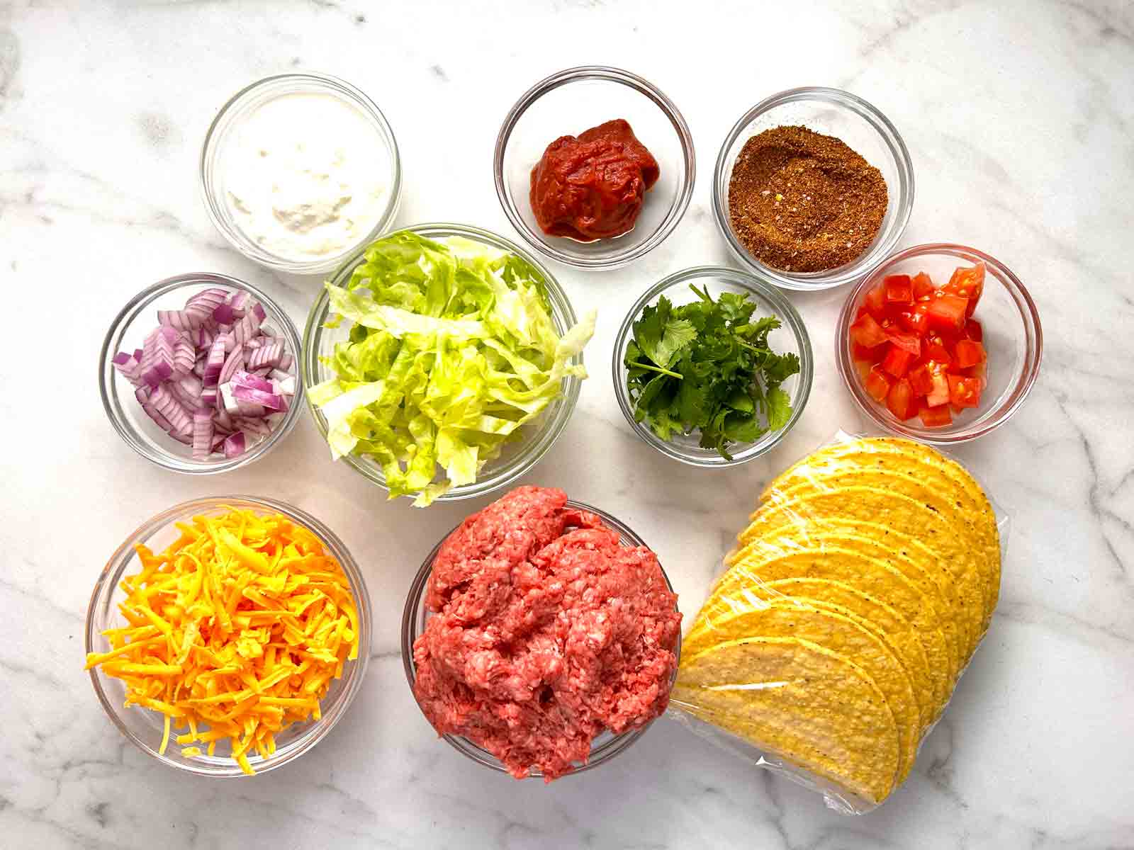 ingredients for tacos prepped in bowls.