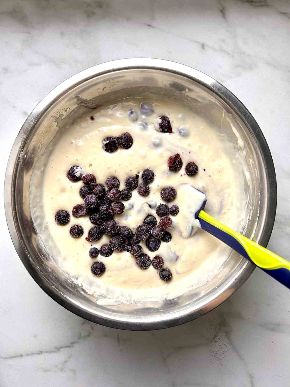 blueberries folded into batter.