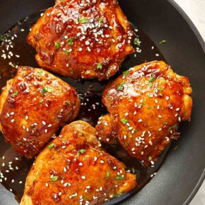 teriyaki chicken thighs in pan.