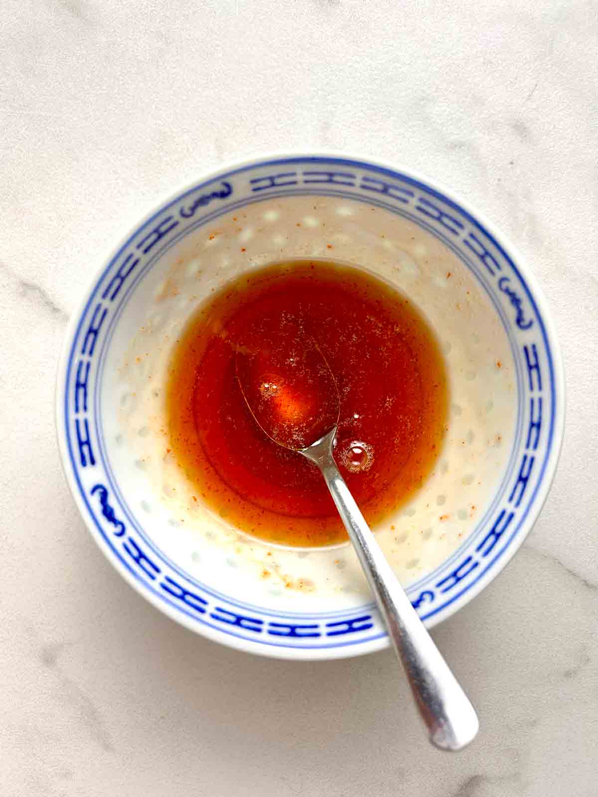 hot honey being mixed in bowl.
