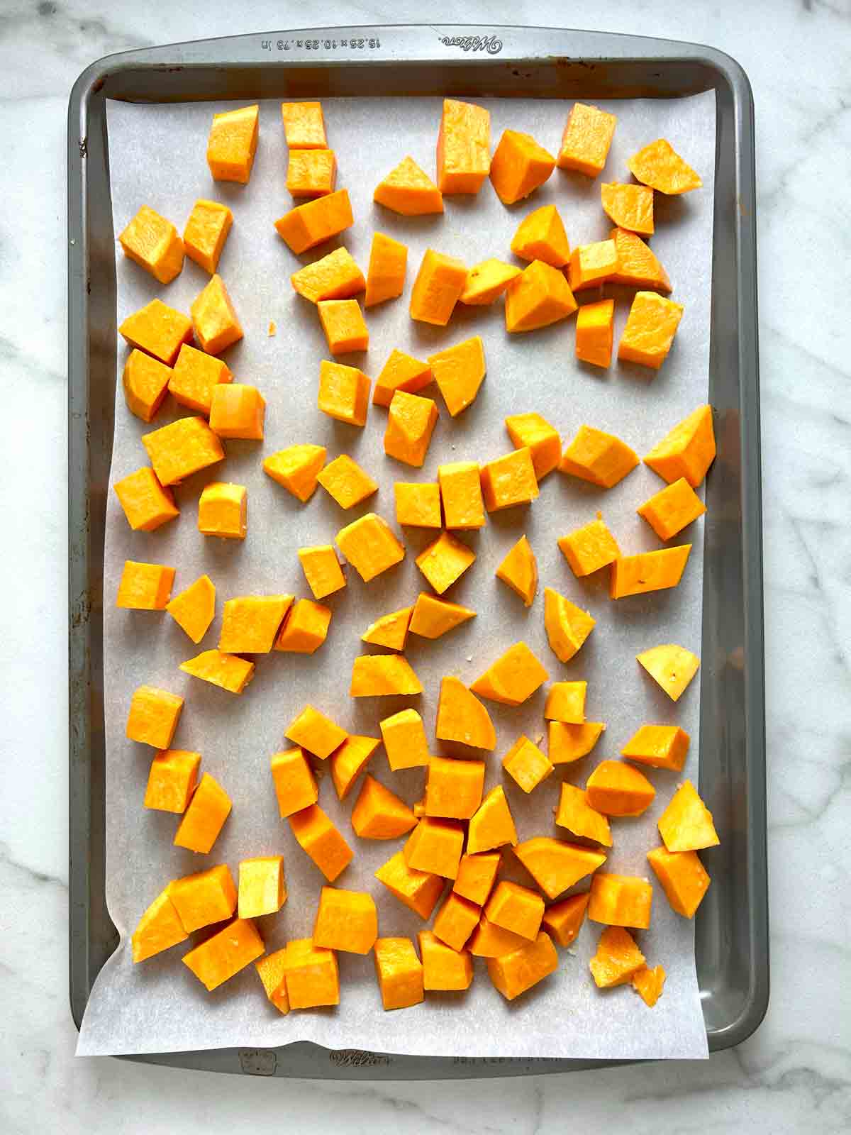 sweet potatoes on baking sheet.