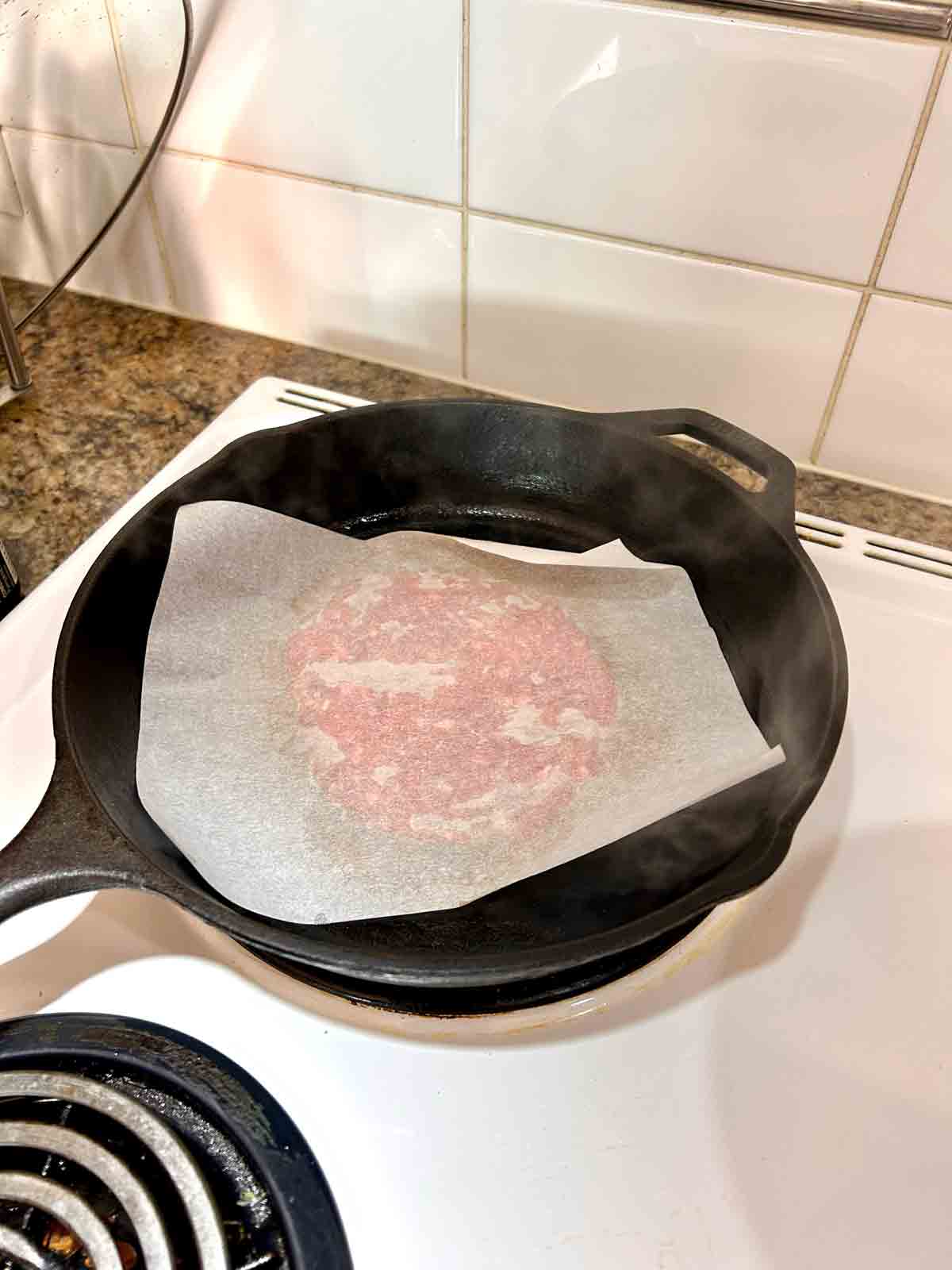 patty and parchment paper after smashing.