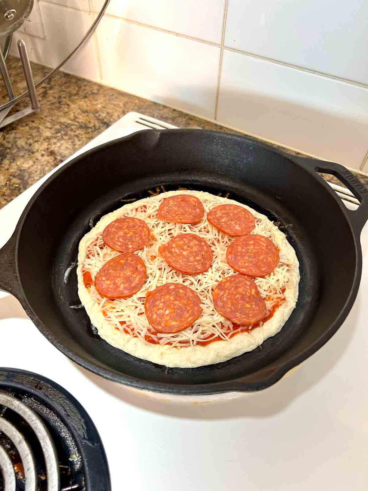 add pepperoni to pizza.