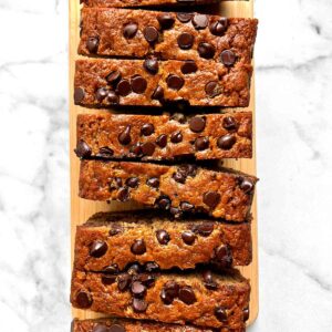overhead shot of chocolate chip banana bread sliced into many pieces.