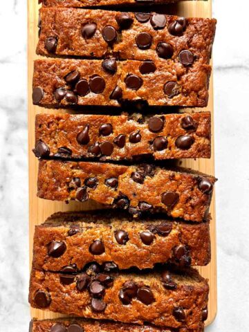 overhead shot of chocolate chip banana bread sliced into many pieces.