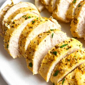 close up of sliced lemon pepper chicken breasts.