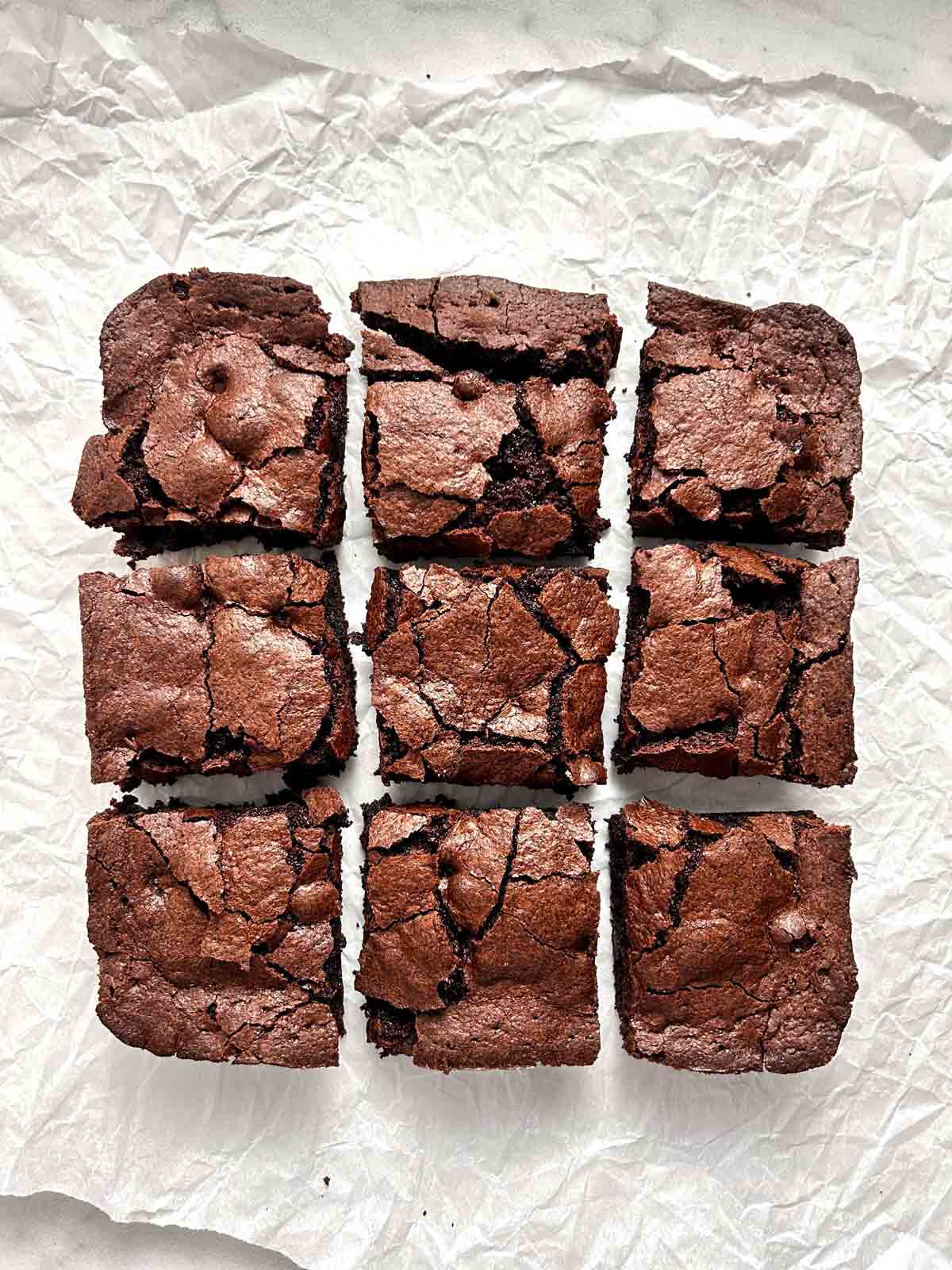 sliced brownies on parchment paper.