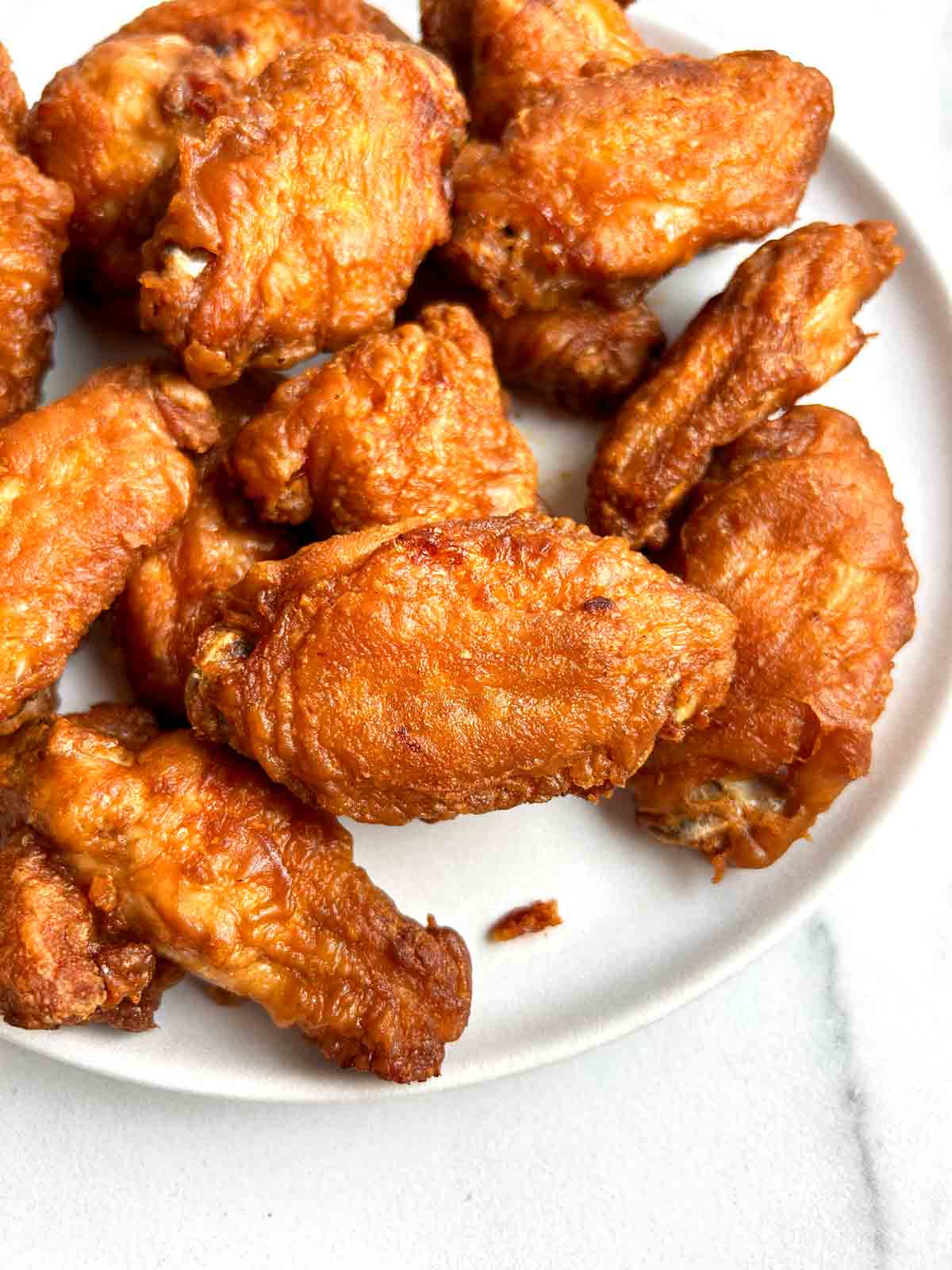 close up of fried chicken wings.