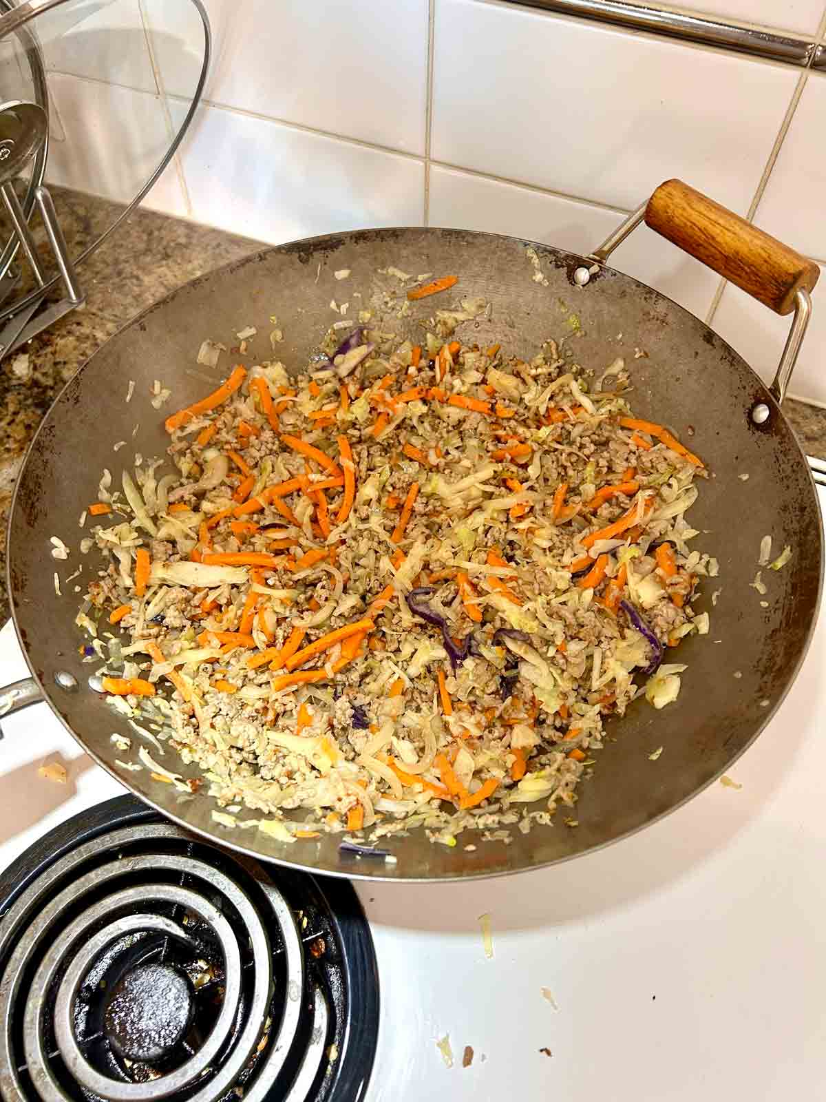 coleslaw mix added to pan.