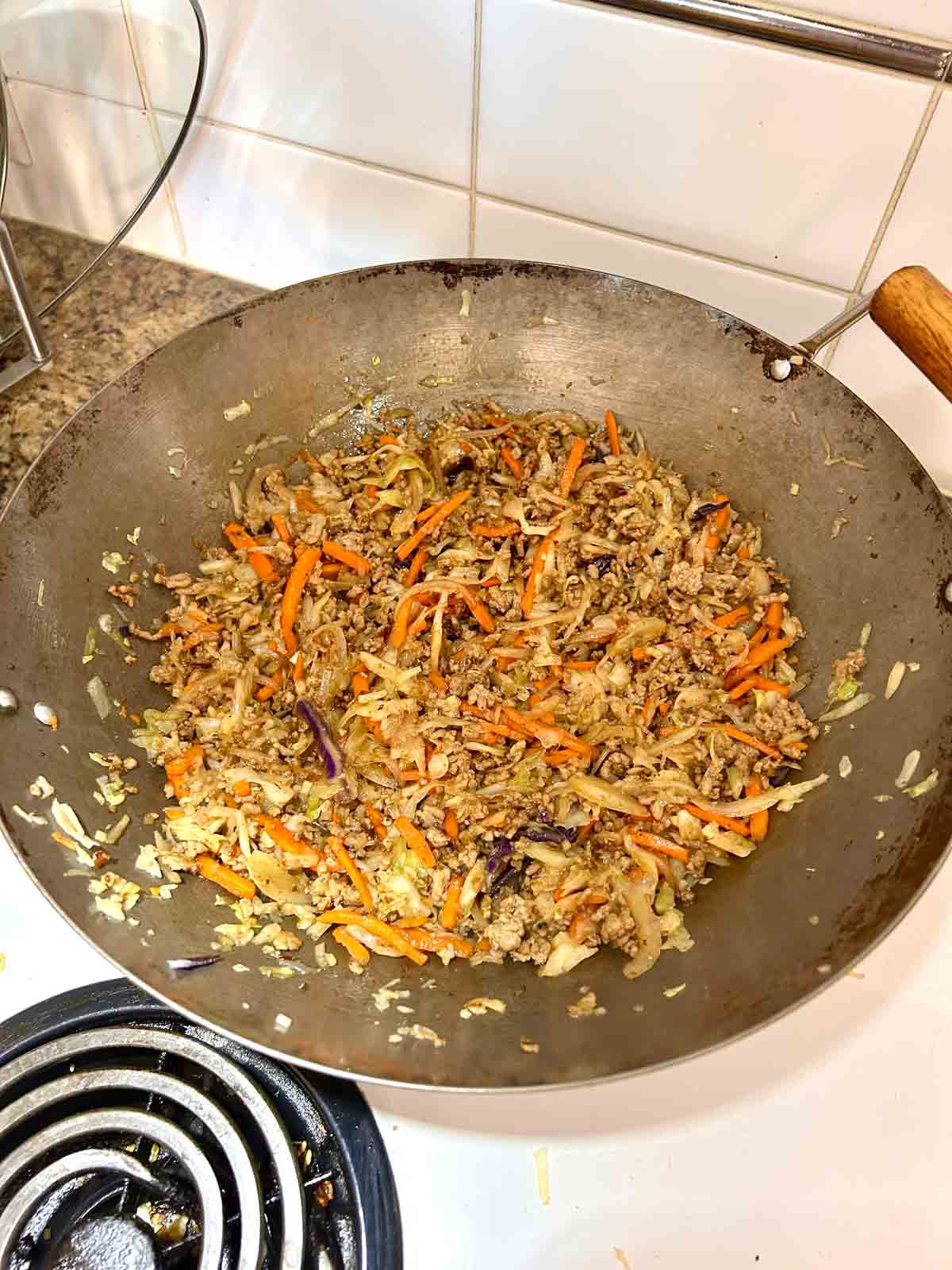 soy sauce and seasonings added to stir-fry.