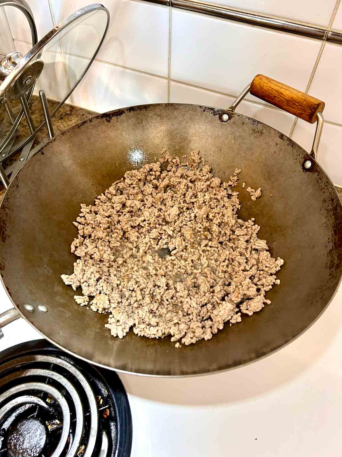 ground pork browning in pan.