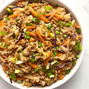 close up of egg roll in a bowl.