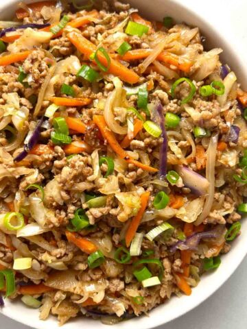 close up of egg roll in a bowl.
