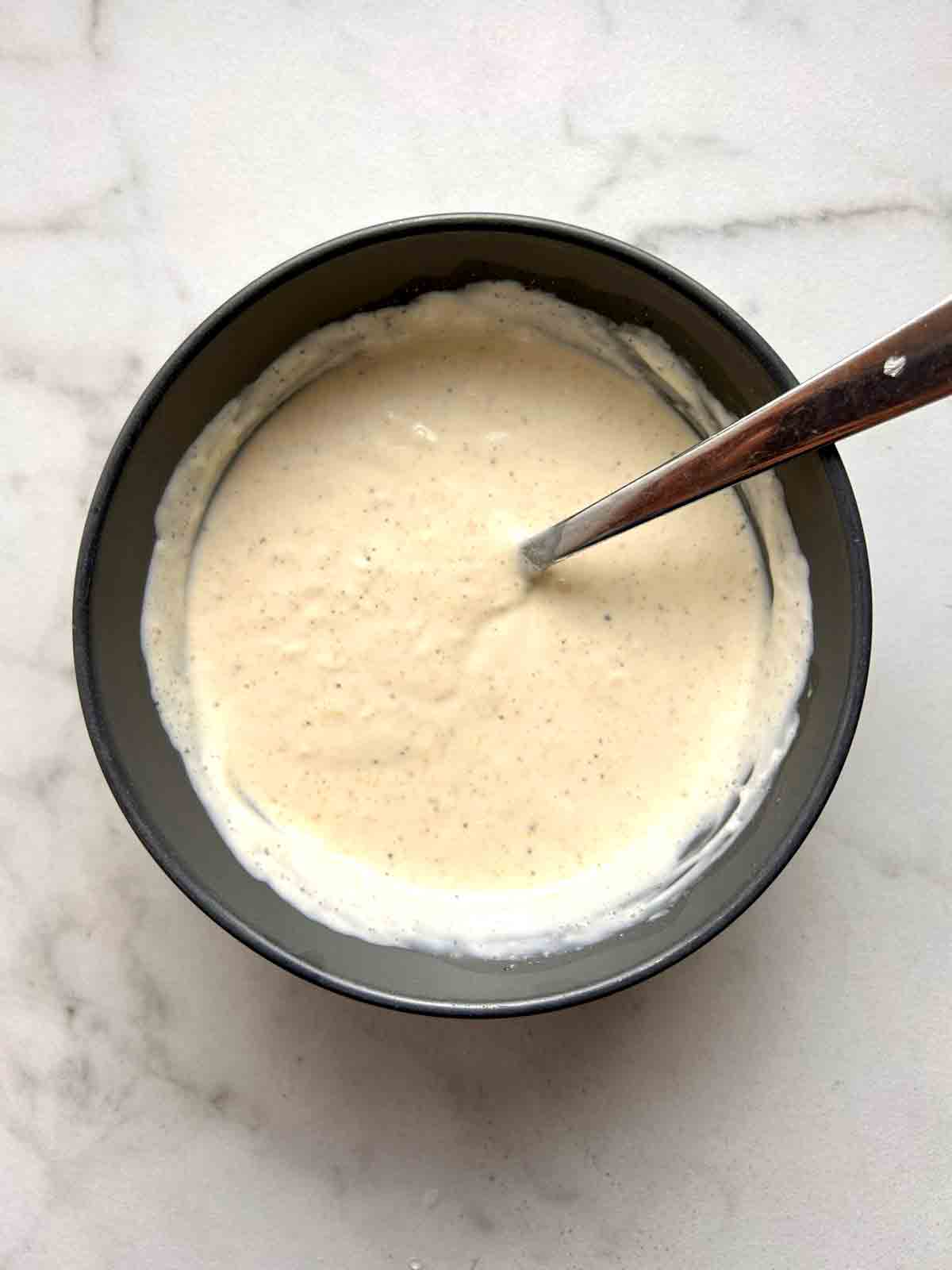 aioli ingredients mixed together in bowl.