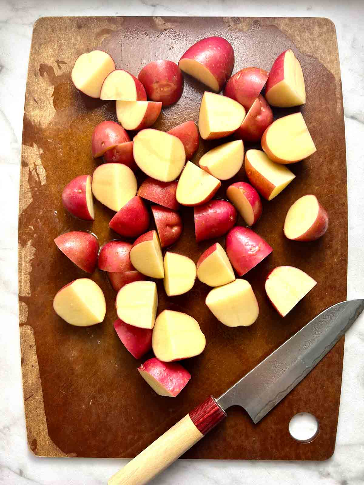 red potatoes chopped into quarters and halves.