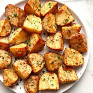 roasted red potatoes on plate.