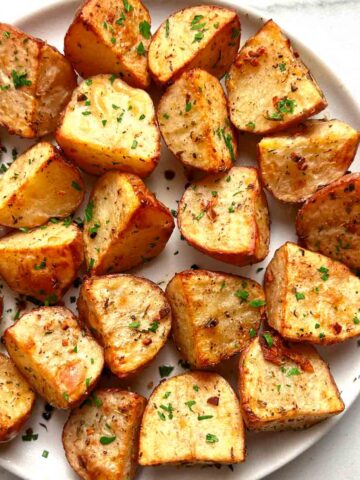 roasted red potatoes on plate.