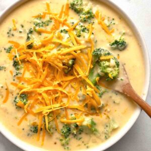 overhead shot of broccoli cheddar soup in bowl.